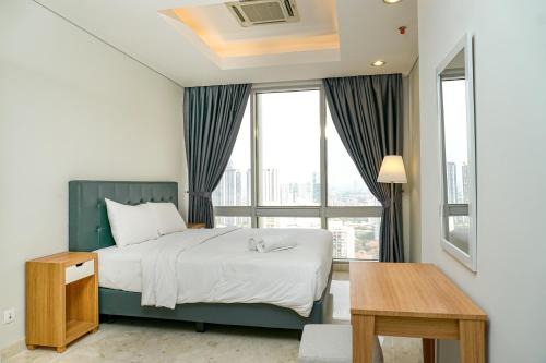 Karet Apartment | Cozy 2BR @ The Masterpiece Condominium Epicentrum Apartment By Travelio