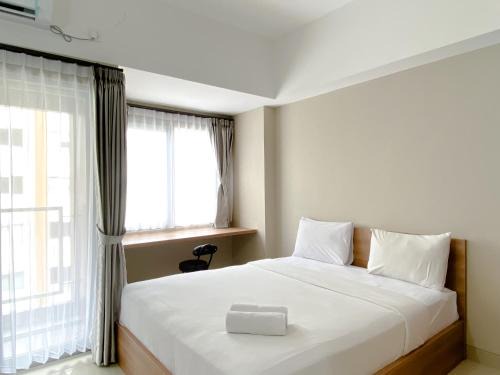 Duren Sawit Apartment | Good Choice and Cozy Studio Gateway Park LRT City Jatibening Apartment By Travelio