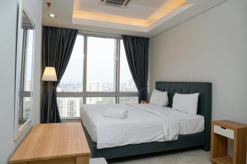 Karet Apartment | Modern and Comfortable 2BR at The Masterpiece Condominium Epicentrum Apartment By Travelio