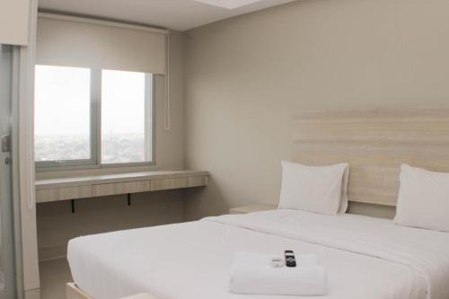 Duren Sawit Apartment | Nice Studio at Gateway Park LRT City Jatibening Apartment By Travelio