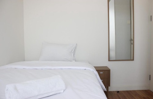 Arjuna Apartment | Artistic 3BR Apartment at Landmark Residence By Travelio