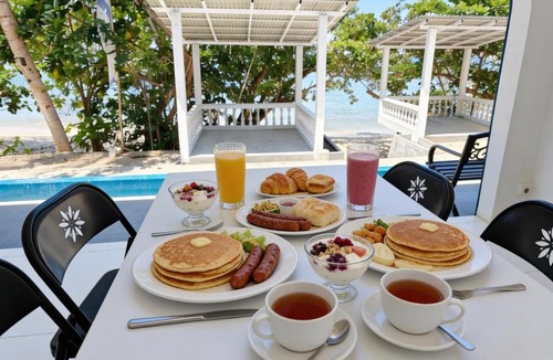 Langowan Resort | De BOUGENVILLE Tulap Beach Front