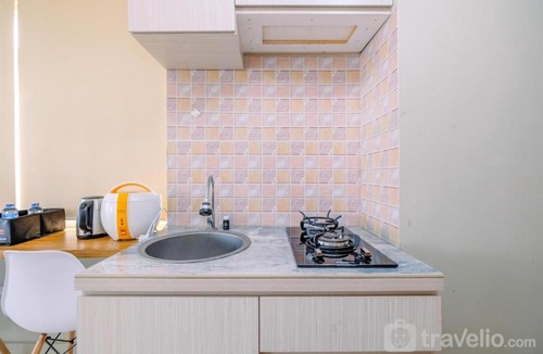 Duren Sawit Apartment | Elegant Studio Apartment at Gateway Park LRT JatibeningCity By Travelio