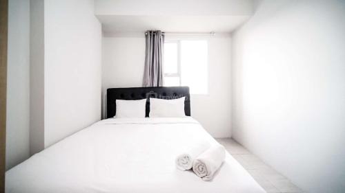 Sidoarjo Apartment | Homey 2BR Apartment at Suncity Residence By Travelio