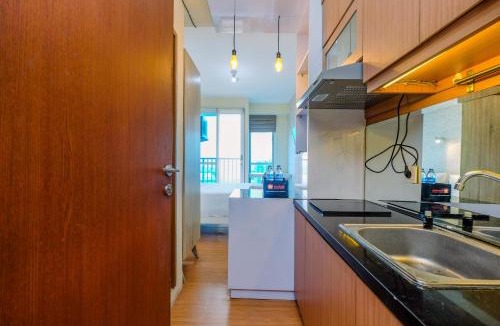 Kayu Putih Apartment | Minimalist Studio with Great City View at Tifolia Apartment By Travelio
