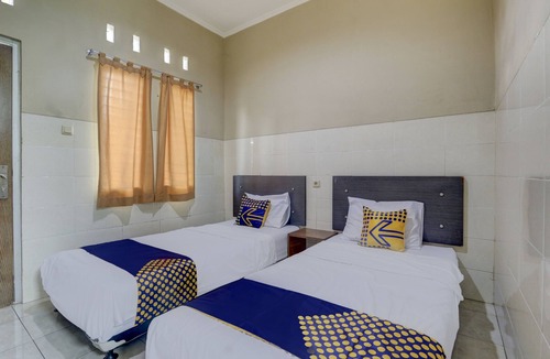Muncar Hotel | OYO Life 90159 Puri Asoka Guest House