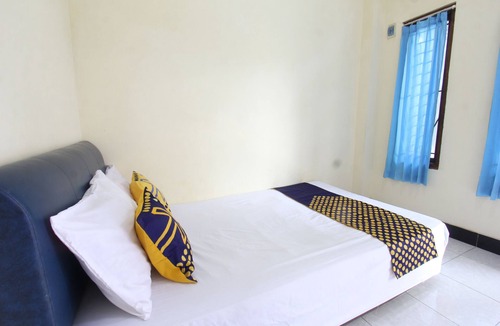 Muncan Hotel | OYO Life 93157 Kos Kaloka