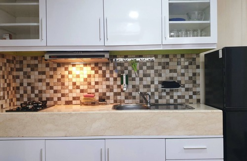Cikarang Apartment | Quiet and Peaceful stay facing directly to the lake with sunset view