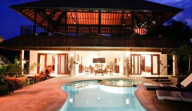A two story house with a big garden and nice swimming pool. in Bali