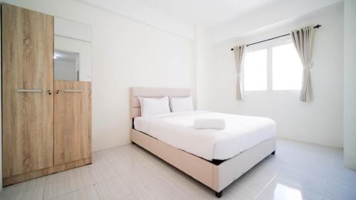 Best Choice and Homey 2BR at Puncak Dharmahusada Apartment By Travelio in Plosobegem