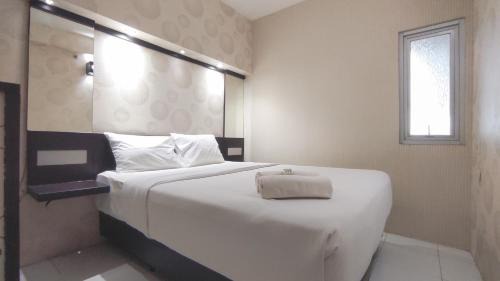 Comfortable Living 2BR at Dian Regency Apartment By Travelio in Surabaya