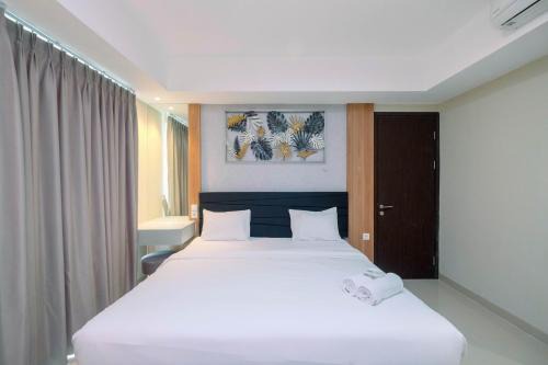 Cozy 2BR Apartment Nine Residence with City View By Travelio in Jakarta