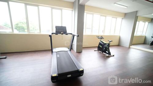 Cozy Living and Tidy 2BR at Puncak Dharmahusada Apartment By Travelio in Plosobegem