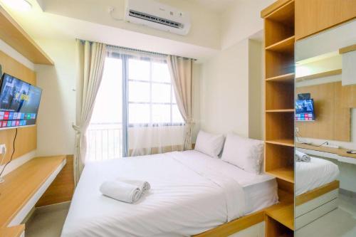 Good Choice and Strategic 2BR without Living Room Evenciio Apartment By Travelio in Depok