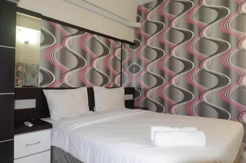 Minimalist 2BR Apartment at Dian Regency By Travelio in Surabaya
