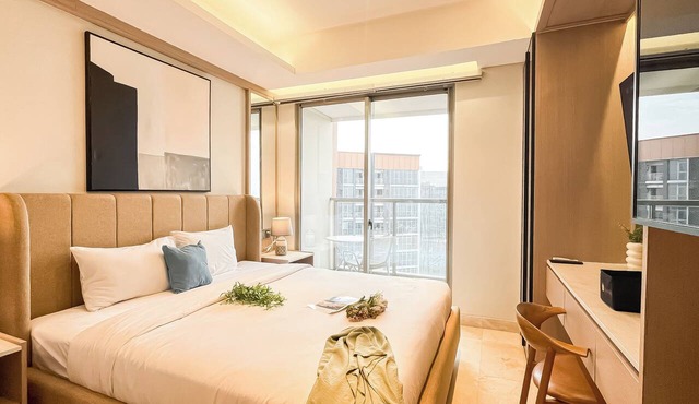 Modern Minimalist Studio Room At Gold Coast Apartment in Jakarta
