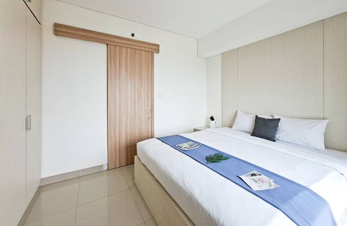 Pondok Aren Apartment | Wooden Accents 1Br Without Living Room At Bintaro Embarcadero Apartment