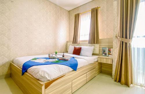 Pondokcina Apartment | Cozy and Elegant 1BR Apartment at Atlanta Residences By Travelio